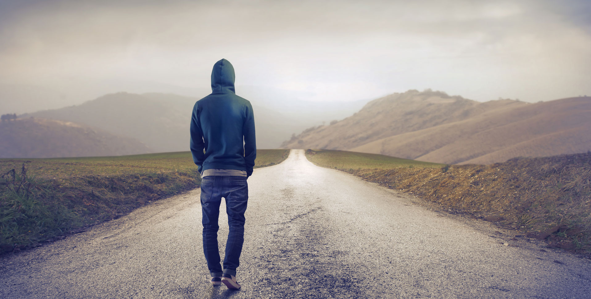 Man Walking Down a Road