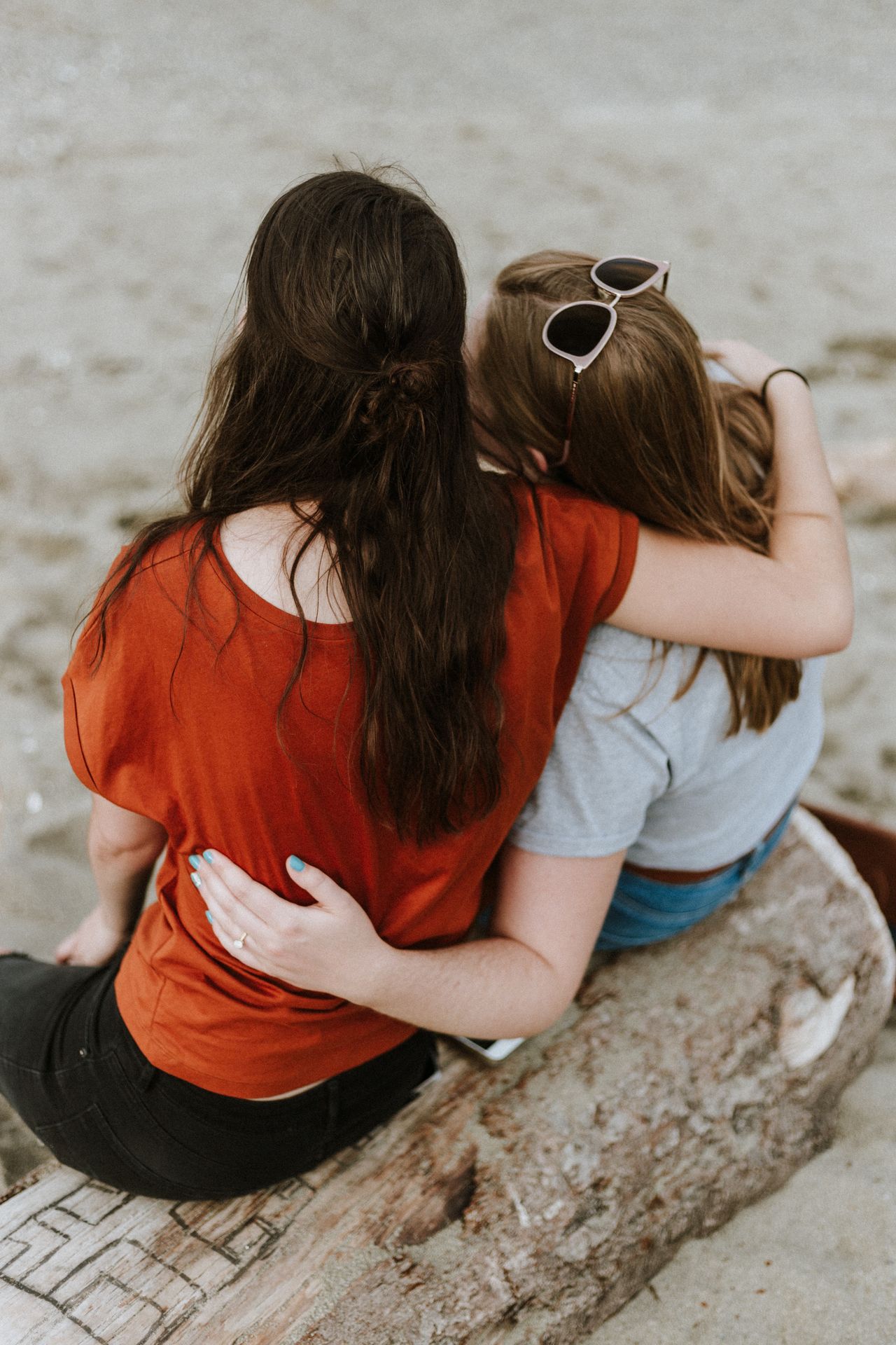 Supporting loved ones - two ladies with arms around each other