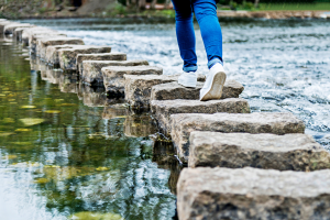 Where did the 12 step programme come from: A person walking on stepping stones