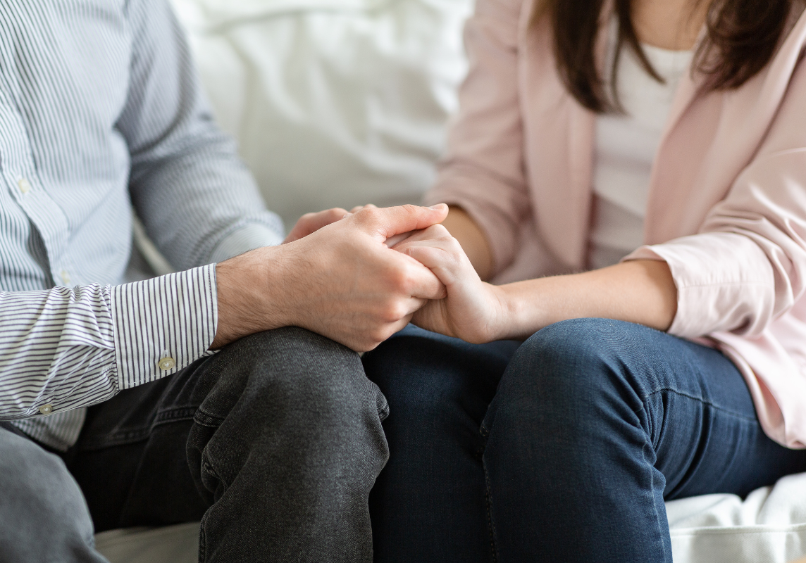 Two hands symbolising rehab aftercare at New Leaf Recovery: drug and alcohol rehab near Belfast